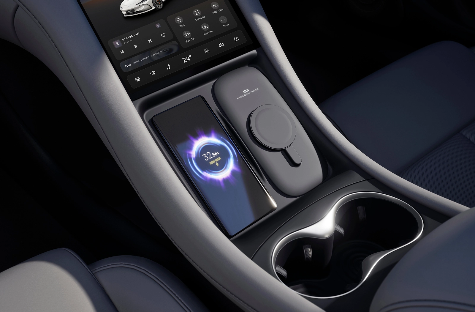 An image of the space between the two front seats. There is a cupholder and a space for a mobile phone